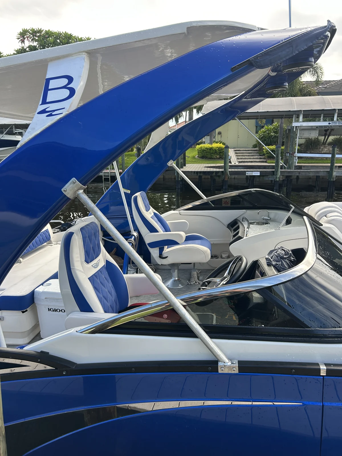 Tubular metal canopy framework on a blue boat